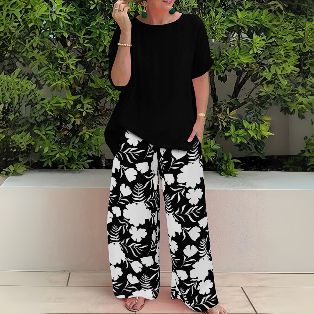 Stylish plus size women's floral print two-piece lounge wear set, offering elegant comfort for summer outfits.