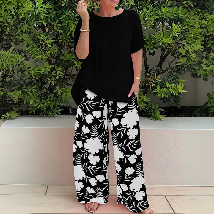 Stylish plus size women's floral print two-piece lounge wear set, offering elegant comfort for summer outfits.