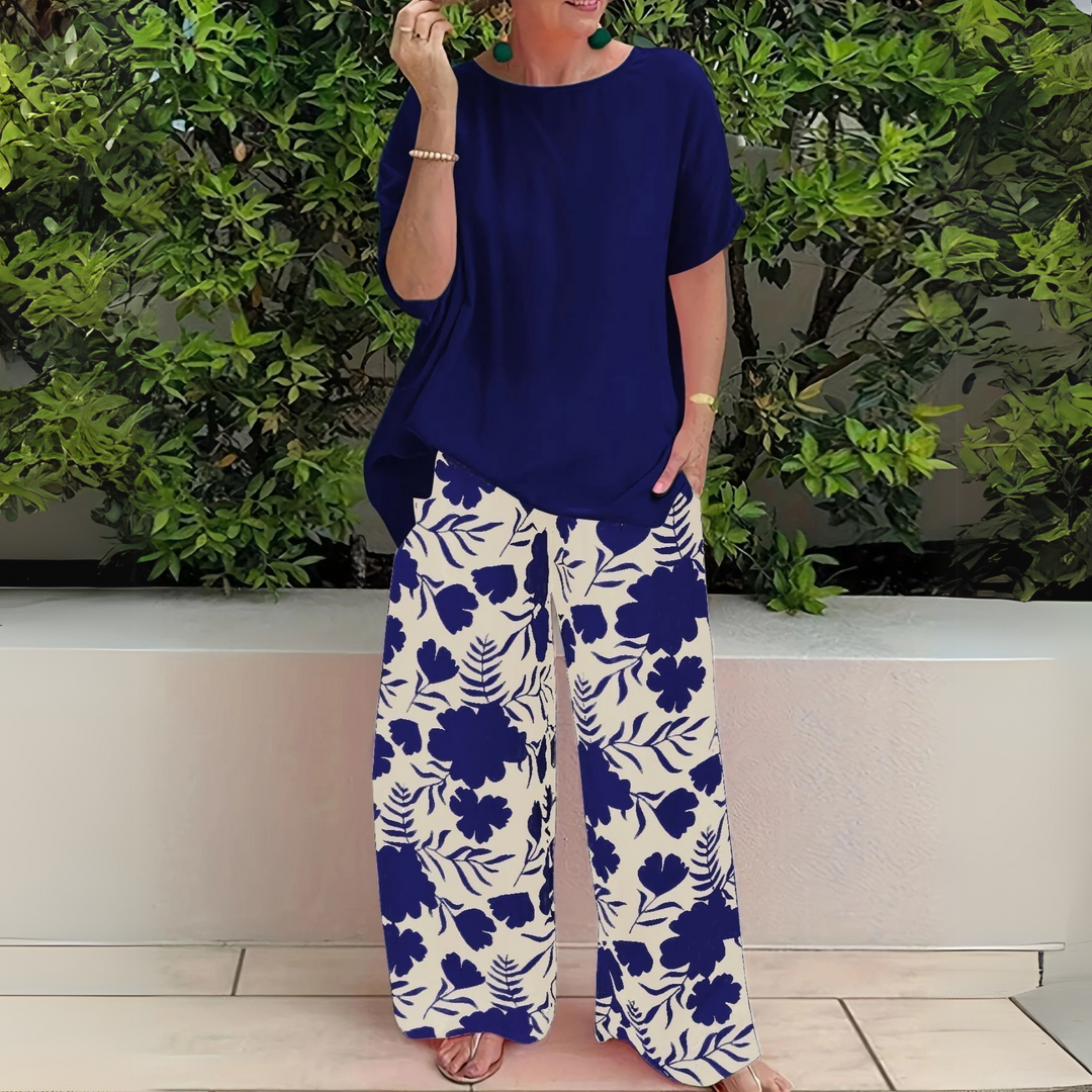 Versatile plus size women's floral top & wide-leg pants two-piece set for elegant summer and lounge wear.