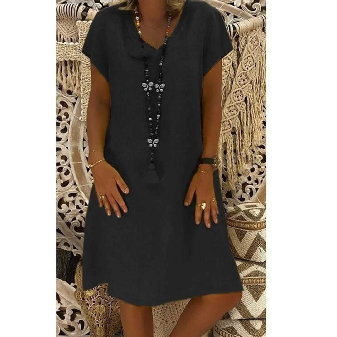 Vibrant short sleeve plus size sundress, relaxed fit for women's comfortable casual summer fashion.
