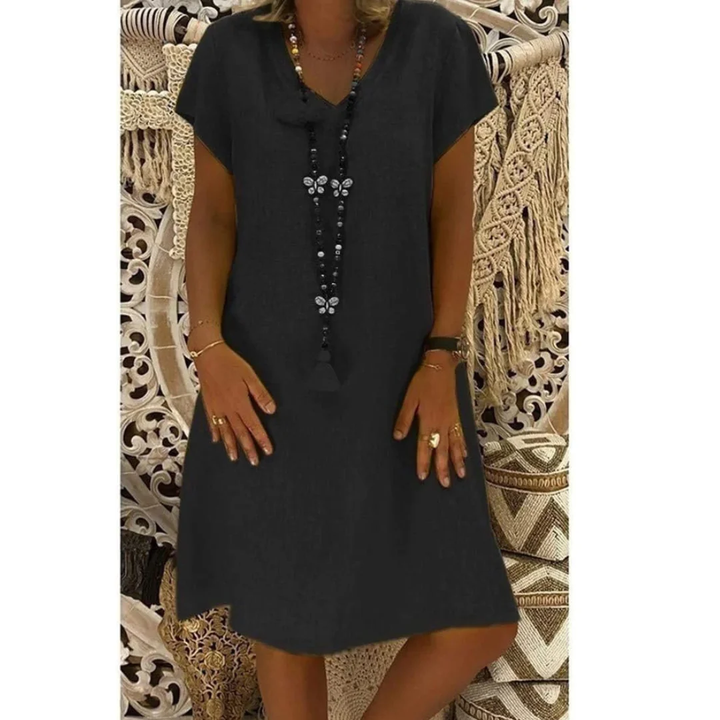 Vibrant short sleeve plus size sundress, relaxed fit for women's comfortable casual summer fashion.