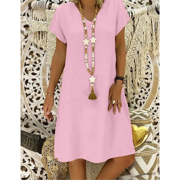 Vibrant casual short sleeve sundress for plus size women, offering relaxed comfort for warm summer days.