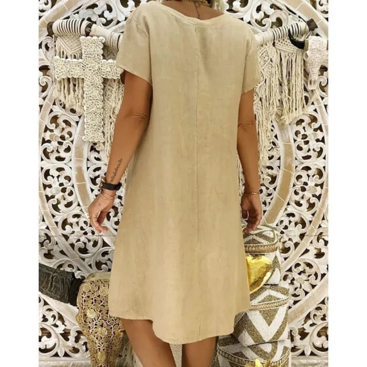 Stylish plus size women's relaxed fit summer dress, perfect casual short sleeve attire for warm weather.