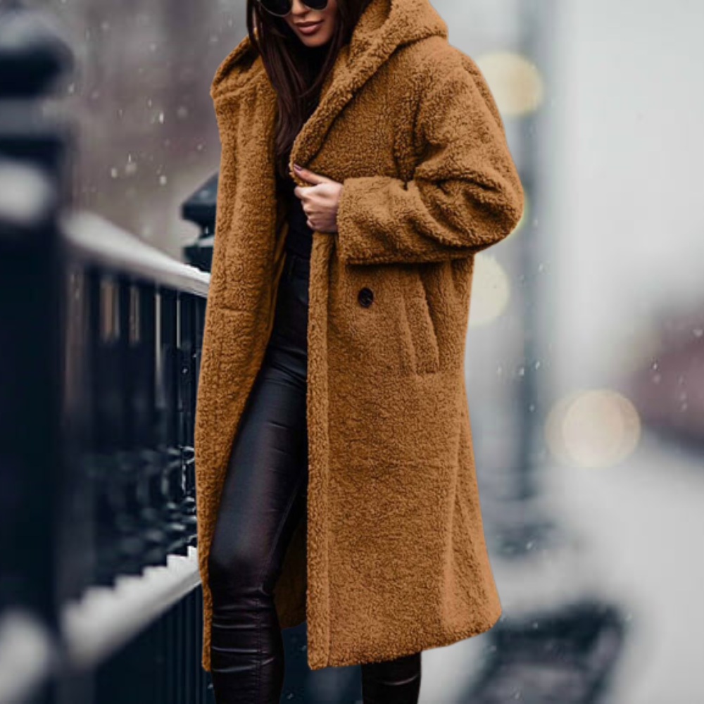 Casual women's plush hooded winter jacket. Stylish long sleeve outerwear for everyday comfort.