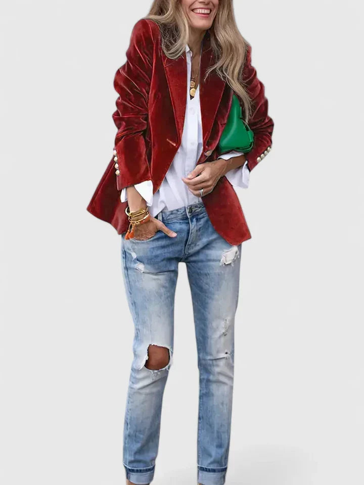 Model wearing a women's plush single-breasted blazer with gold buttons, showcasing tailored fit and elegance.