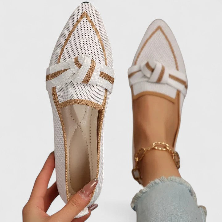 Elegant women's slip-on loafers, featuring a pointed toe and contrast trim for comfortable everyday style.