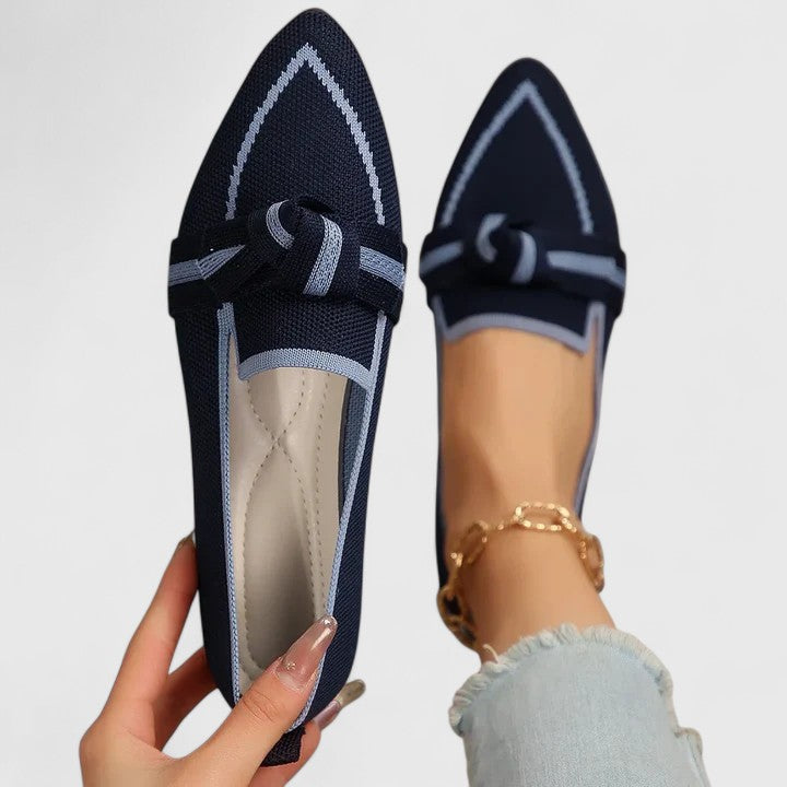 Easy slip-on women's pointed toe loafers, featuring distinctive contrast trim for modern versatile style.