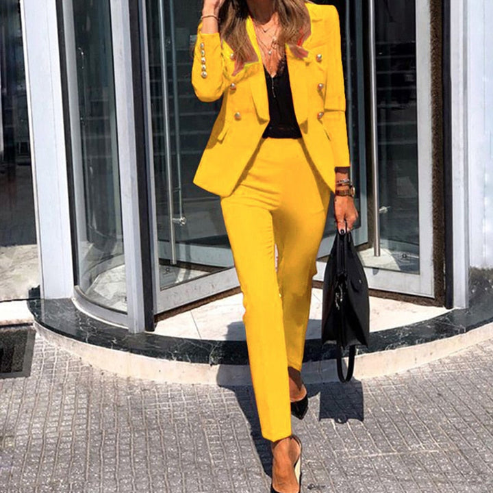 Women's polished double-breasted suit set. Tailored blazer & pants for professional office wear, business, & events.