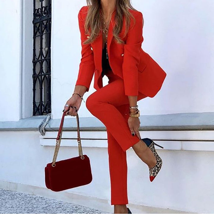 Professional women's business suit set. A double-breasted blazer & tailored pants for formal office attire & events.