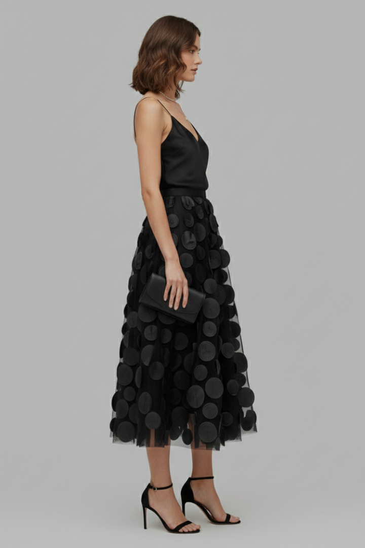 Comfortable women's polka dot full skirt with elastic waist. Flowy A-line design for elegant summer style.
