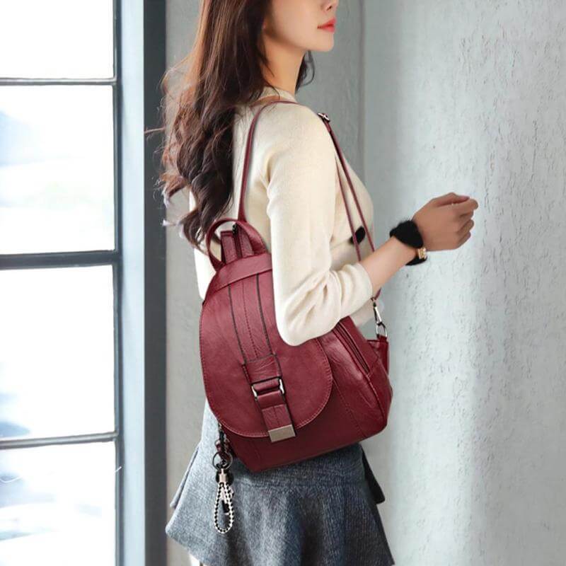 Professional women's leather backpack, water-resistant, perfect for business or leisure.