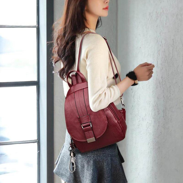 Professional women's leather backpack, water-resistant, perfect for business or leisure.