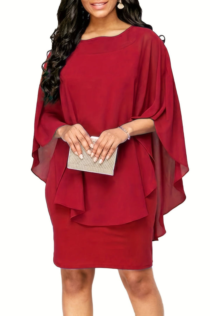 Woman wearing a relaxed fit printed midi dress, styled for casual daytime elegance. Versatile summer fashion.
