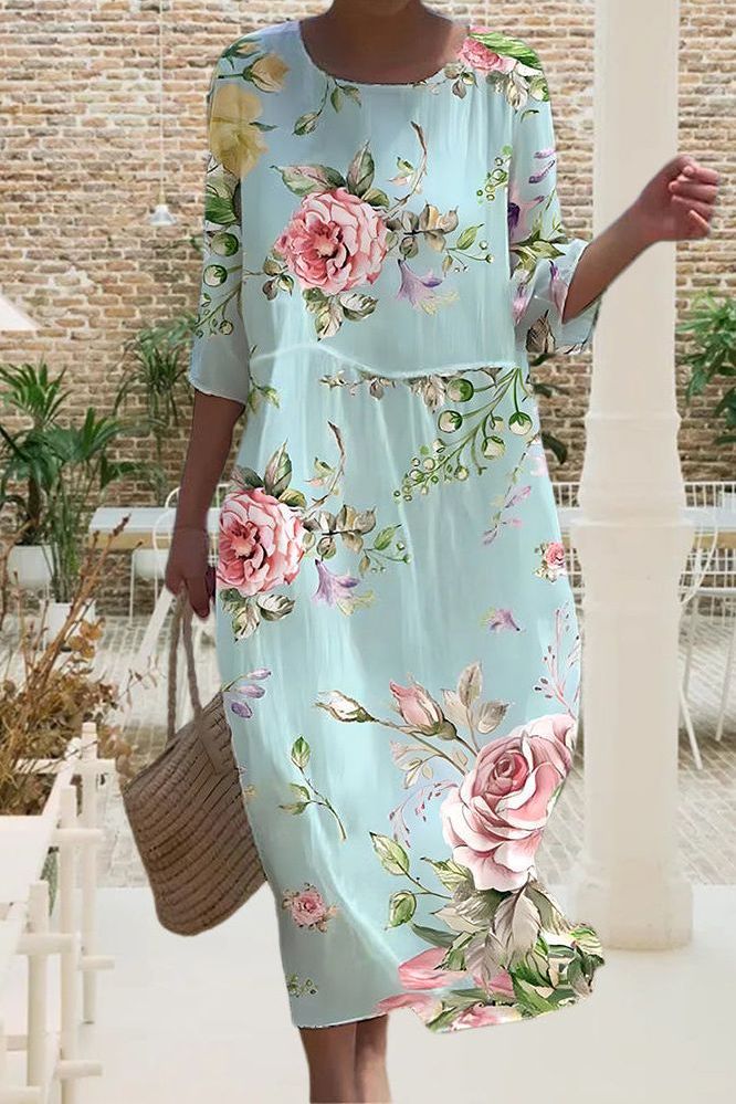 Fashionable women's relaxed fit midi dress. Versatile and comfortable, ideal for spring and summer casual wear.