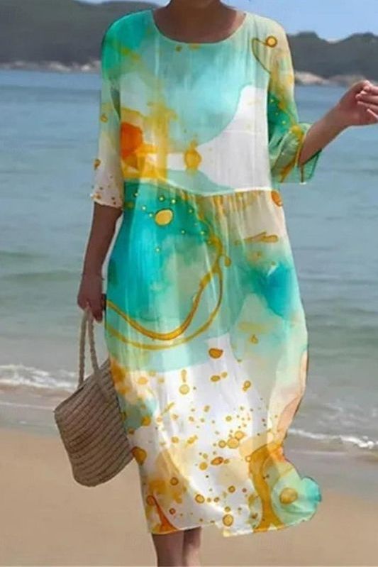 Full view of a women's patterned midi dress, highlighting its relaxed silhouette and stylish print for everyday comfort.