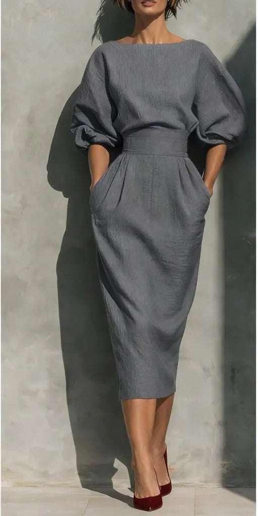 Versatile women's puff sleeve summer midi dress with pockets, comfortable and stylish for warm-weather elegance.