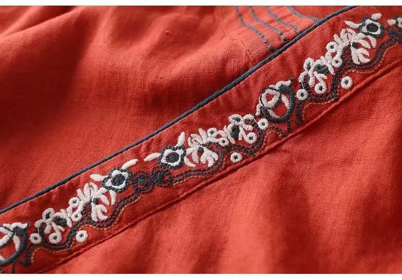 Purple & red patterned women's blouse, relaxed fit, elegant V-neck embroidery.
