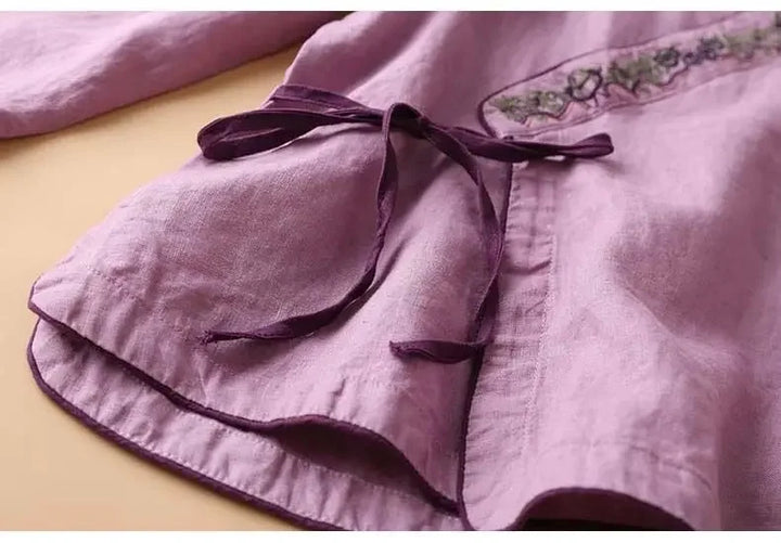 Embroidered V-neck patterned blouse, women's relaxed fit, stylish comfort.