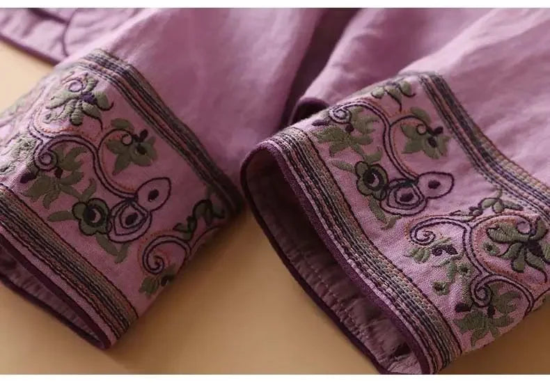 Elegant patterned blouse for women, relaxed fit, detailed embroidery.