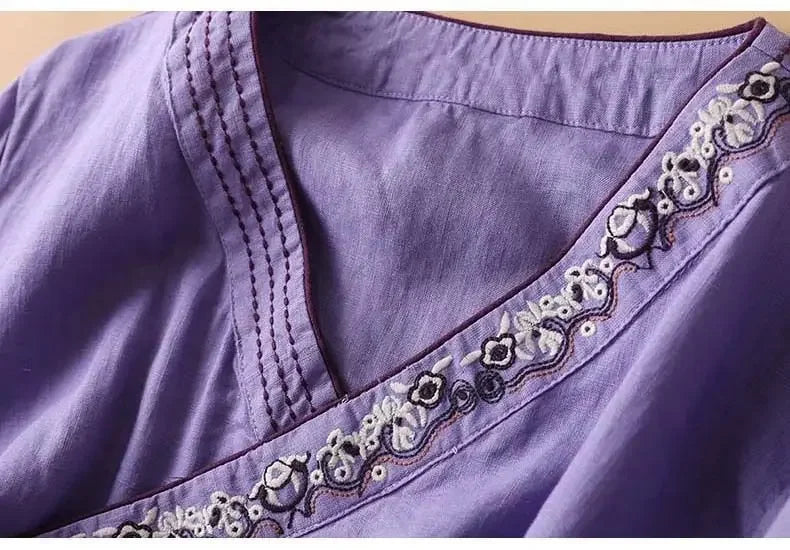 Embroidered relaxed fit blouse for women, stylish patterned V-neck top.