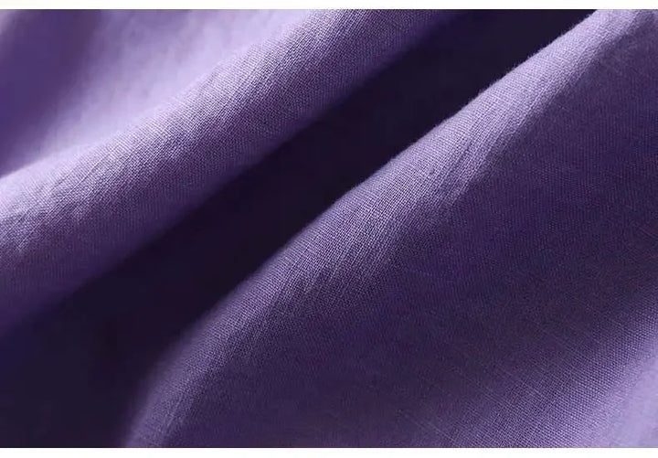 Casual chic patterned ladies' top, embroidered, relaxed fit, rich purple hue.