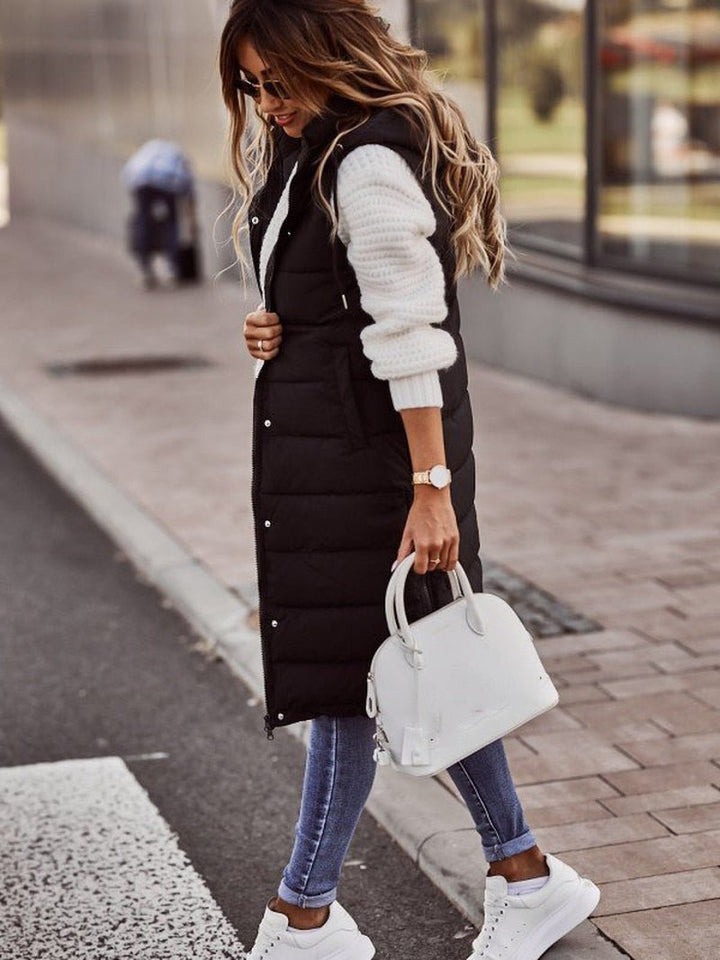Women's quilted long bodywarmer vest, ideal for fall fashion, winter layering & stylish casual outerwear.