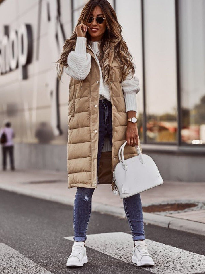 Chic women's quilted long vest, an essential sleeveless outerwear piece for elegant everyday fall & winter style.