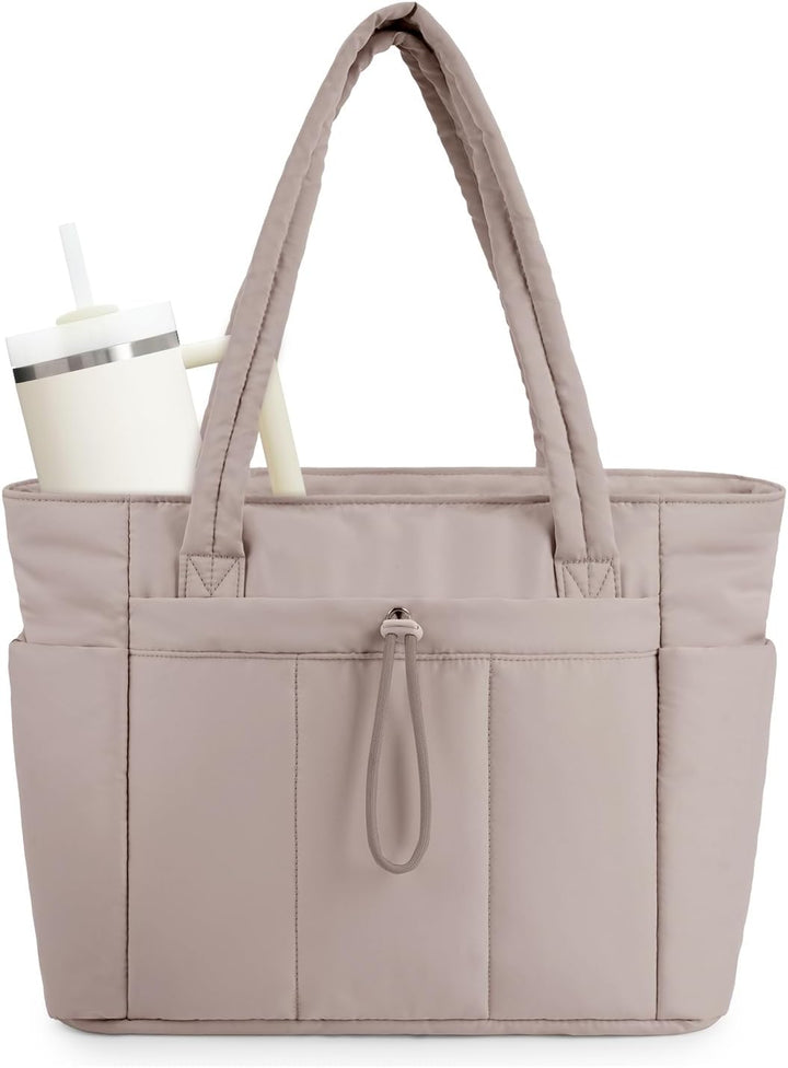 Women's daily tote: quilted puffer, designed for comfort & carrying laptops, with luggage sleeve.