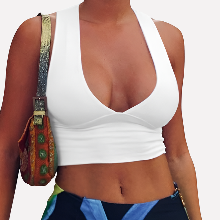 Chic women's deep V-neck racerback crop tank top with cutouts, perfect for trendy summer fashion & warm weather.