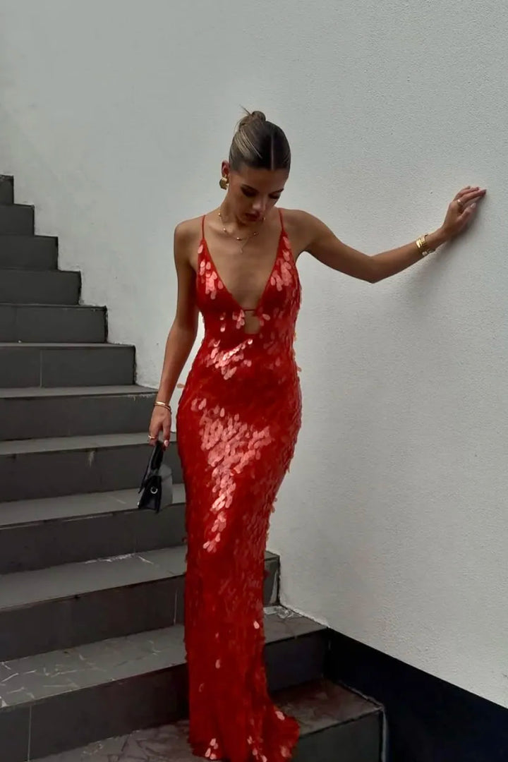 Women's red sequin mermaid homecoming dress with backless design, perfect for formal events.