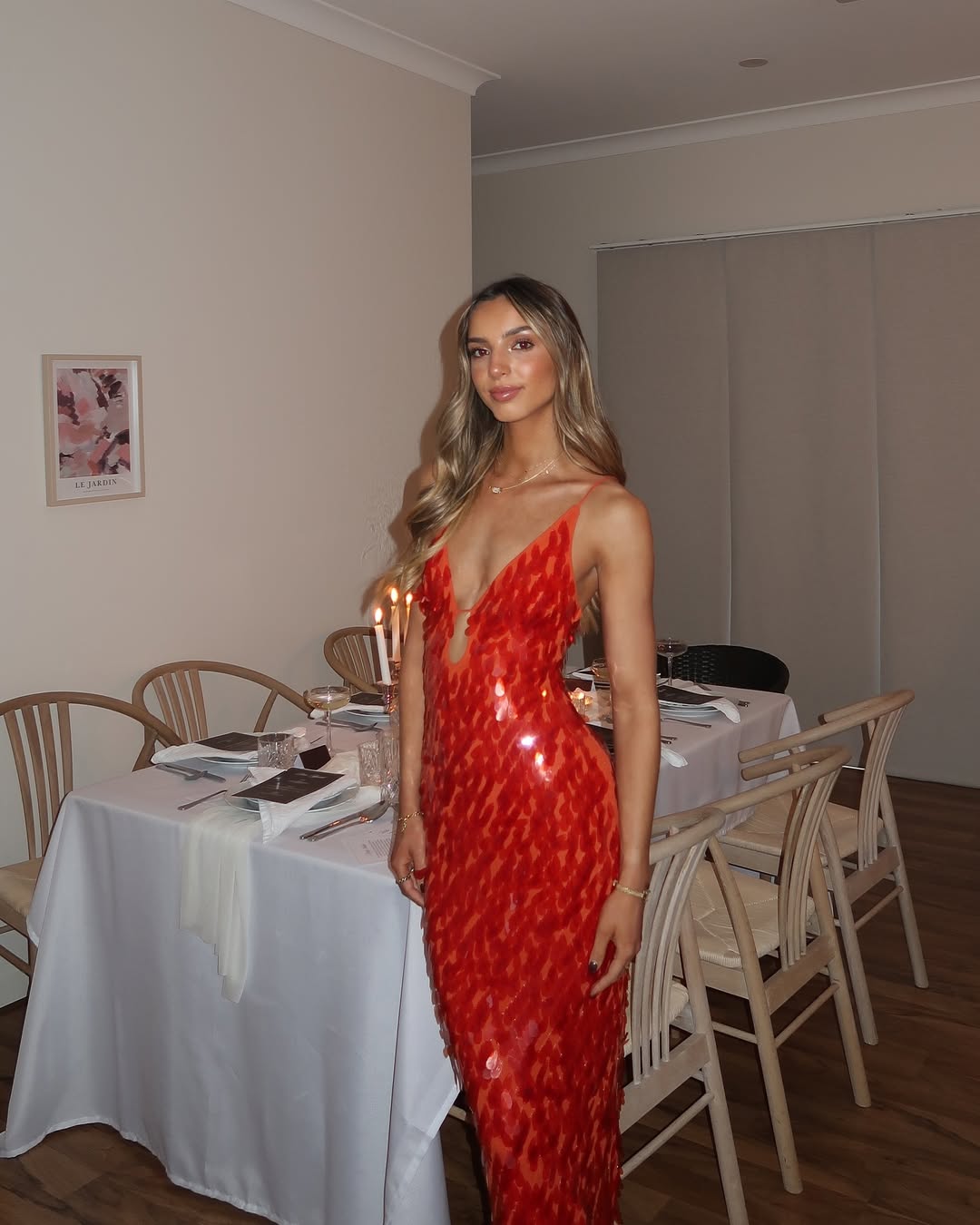 Glamorous women's red sequin mermaid homecoming dress with a daring backless design and flattering fit.