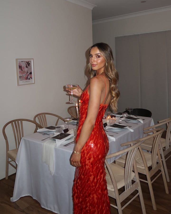 Sparkling red sequin backless mermaid party dress for women, ideal as a formal gown or evening wear.