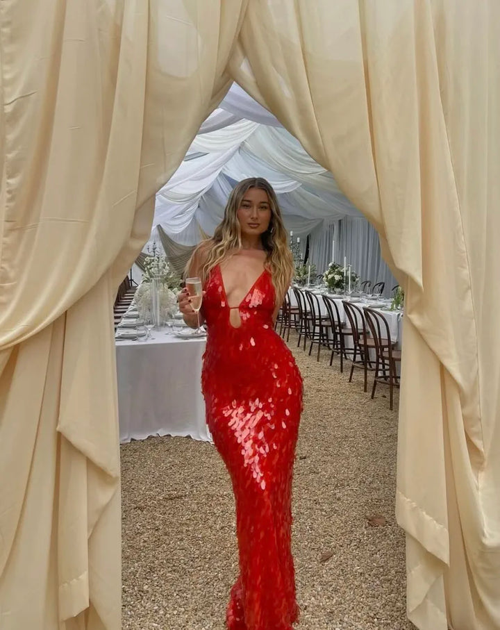 Red sequin spaghetti strap V-neck mermaid dress, a gorgeous backless formal gown for special occasions.