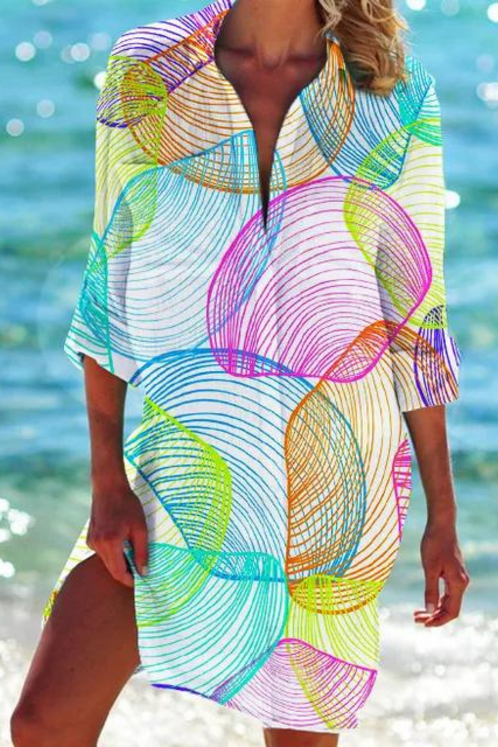 Chic women's beach cover up tunic with a relaxed fit and beautiful seashell & coral print. Ideal for vacation.