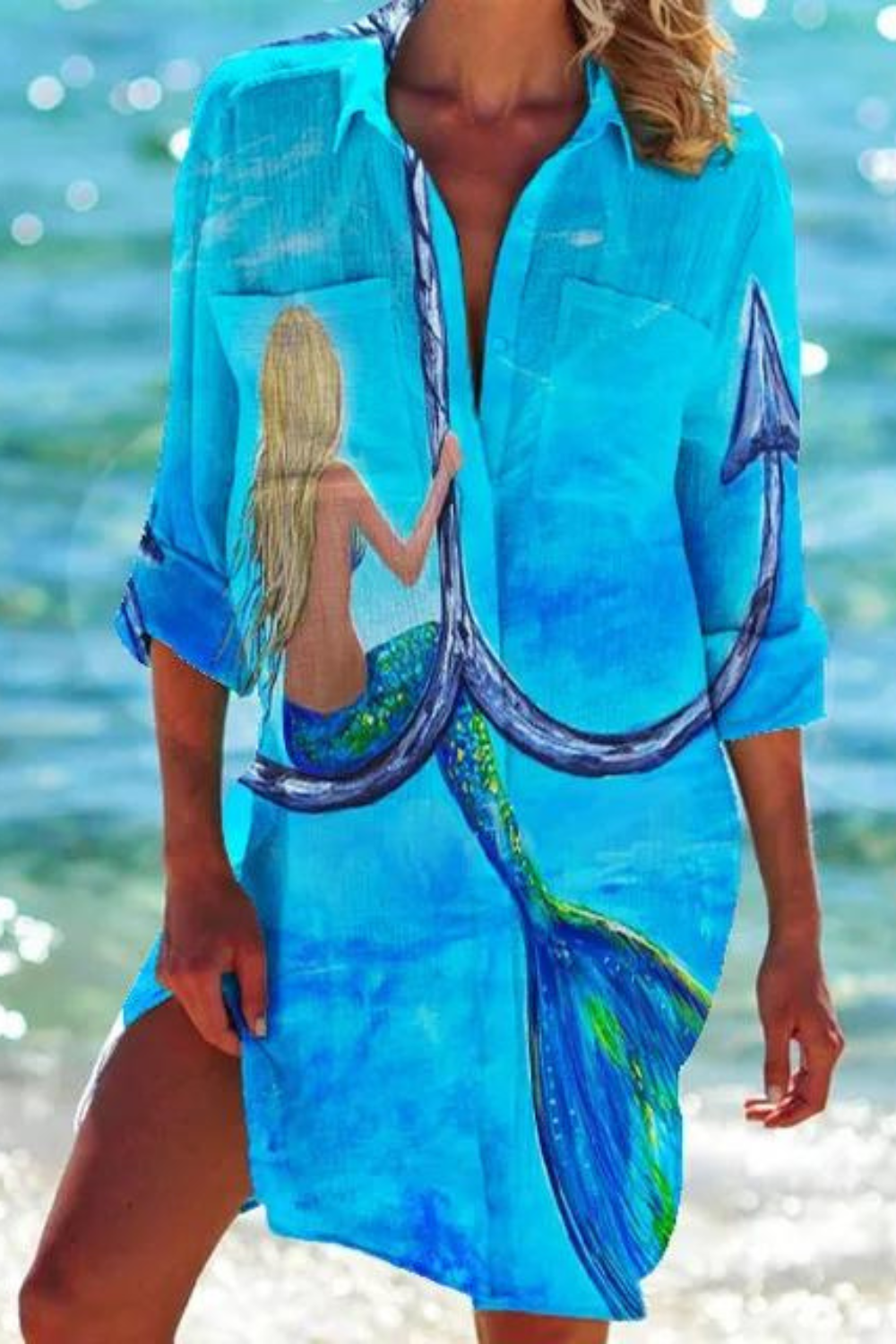 Coastal women's tunic cover up featuring a lively seashell and coral ocean print. Ideal for beach days.