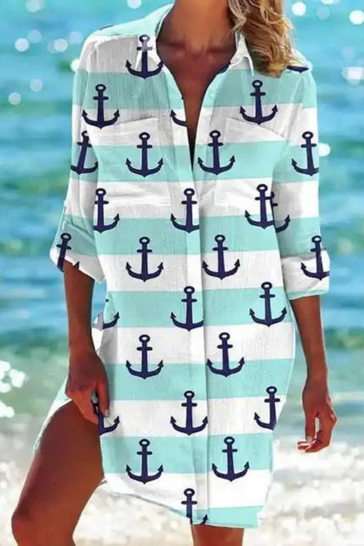 Vibrant women's button-down longline beach cover up with a beautiful seashell & coral print. Summer resort wear.