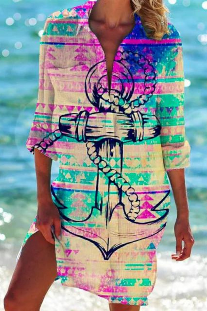 Relaxed women's beach cover up, coastal style, with a colorful seashell and coral ocean print. Vacation essential.