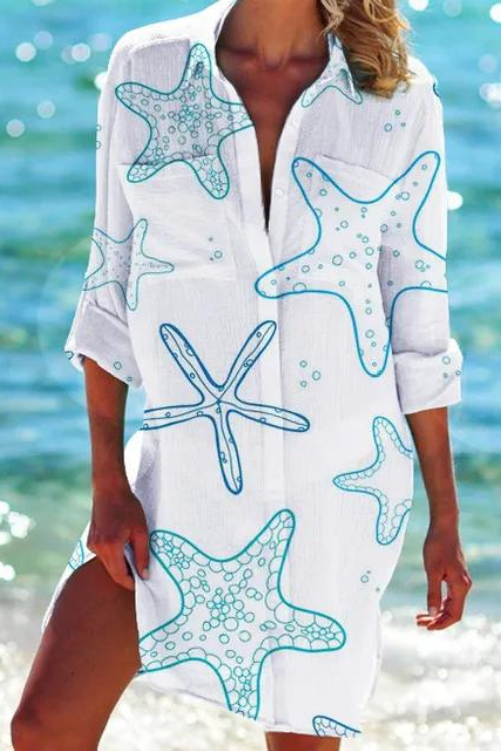 Casual women's button-down beach cover up with a lively seashell and coral print. Great for summer & vacation.