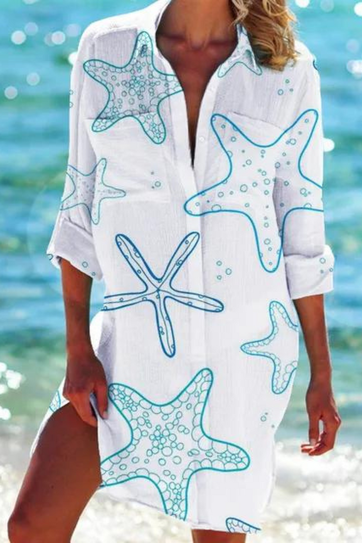 Casual women's button-down beach cover up with a lively seashell and coral print. Great for summer & vacation.