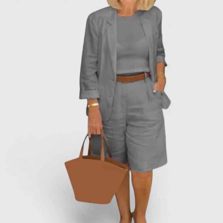 Relaxed fit women's tailored blazer & Bermuda shorts set. Smart casual two-piece ideal for comfortable summer style.