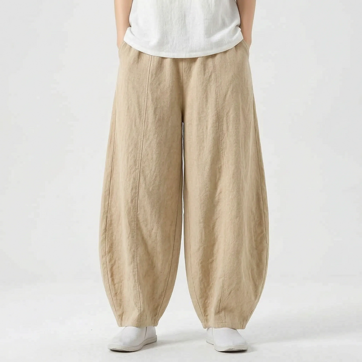 Woman walking in comfortable relaxed fit barrel pants with wide leg, ideal for active casual wear.
