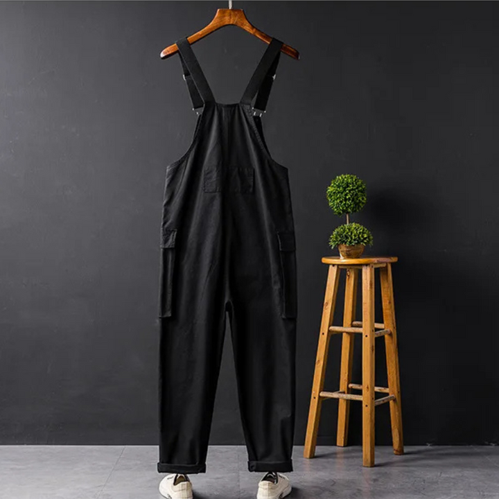 Relaxed fit women's bib overalls: classic sleeveless jumpsuit with practical patch pockets.