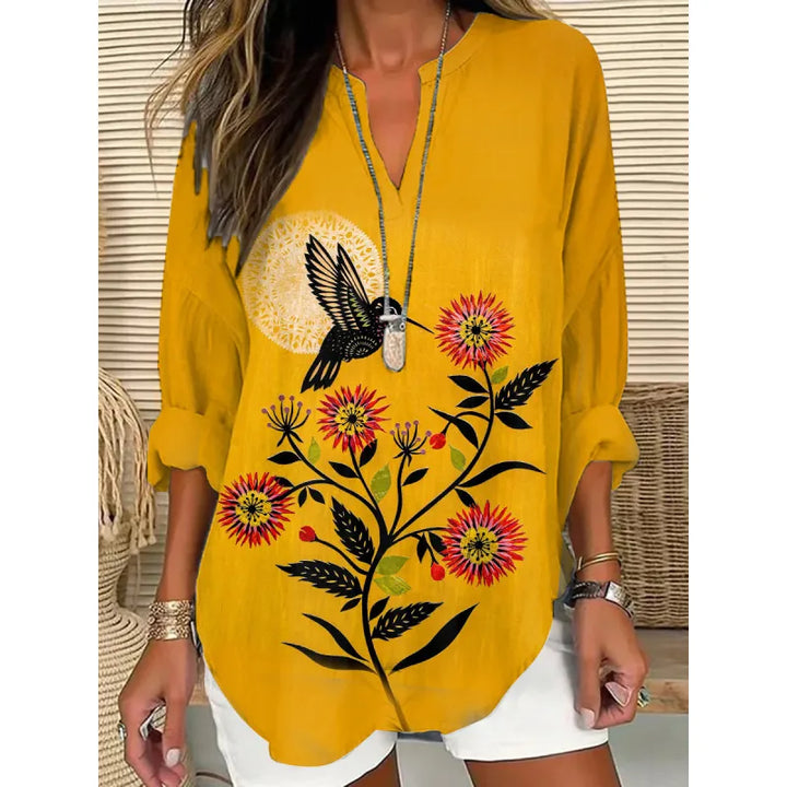 Stylish women's relaxed fit blouse, ideal for office chic or everyday fashion with its split neck and cuffed sleeves.