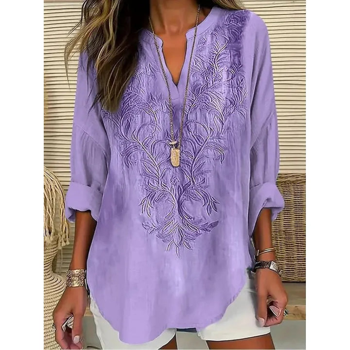 Women's casual relaxed fit blouse with a flattering split neck and three-quarter cuffed sleeves.