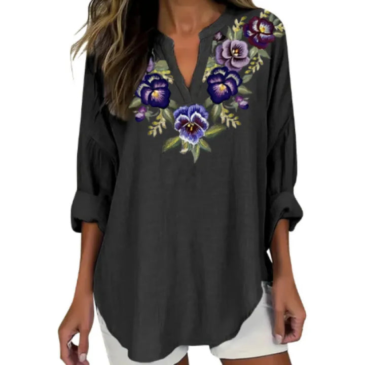 Fashionable spring women's blouse in a relaxed fit, featuring a chic split neck and cuffed three-quarter sleeves.