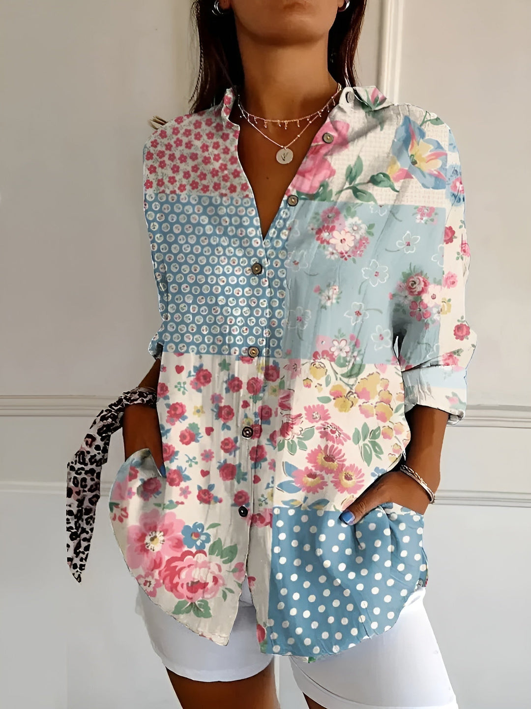 Stylish women's relaxed fit button-down blouse, a versatile long-sleeve top for casual or office wear.