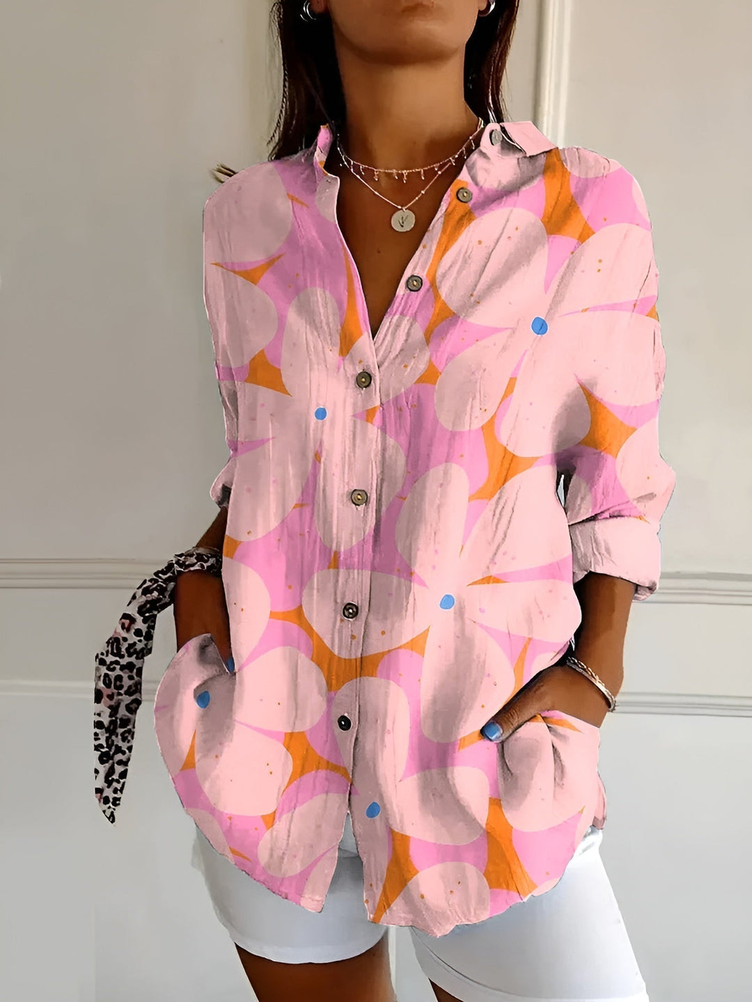 Comfortable long-sleeve women's button-down blouse with pocket detail, perfect for all-season style.