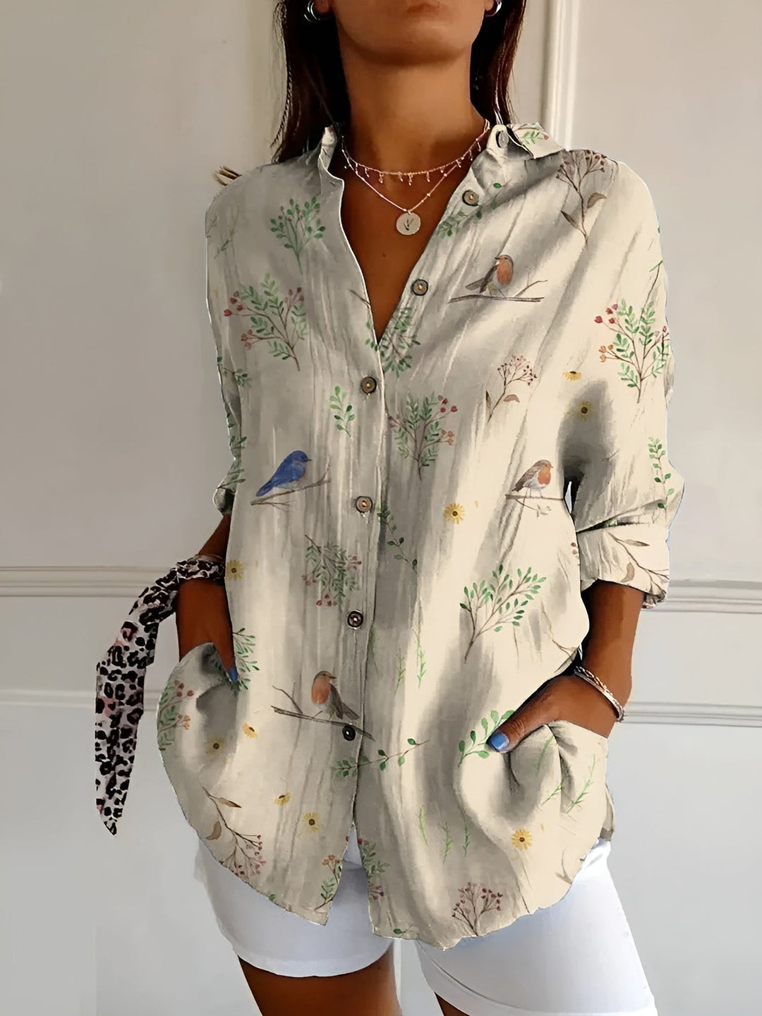 Relaxed fit women's v-neck long-sleeve blouse, an effortless button-down top for versatile everyday wear.