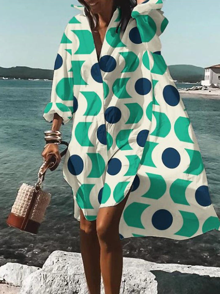 Flowy, relaxed fit women's button-down midi shirt dress with short sleeves, great for warm weather style.