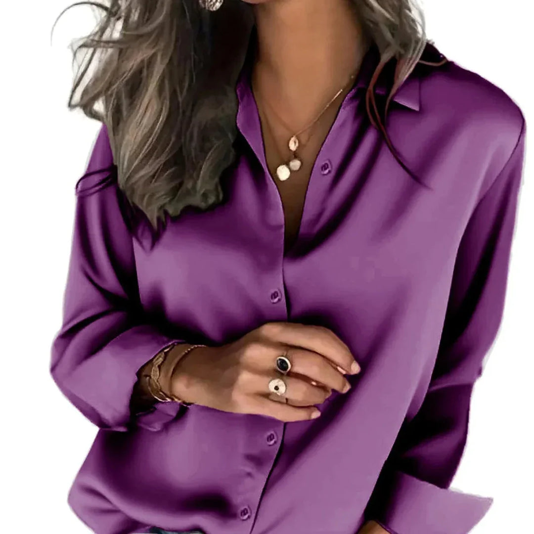 Women's relaxed fit button-down shirt in a soft fabric, perfect for casual chic or professional office wear.